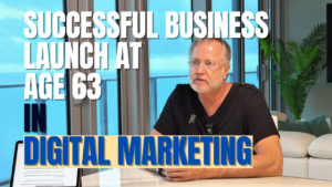 John, a 63-year-old digital marketing entrepreneur, celebrating his success in a modern home office with the Legacy Builder Program